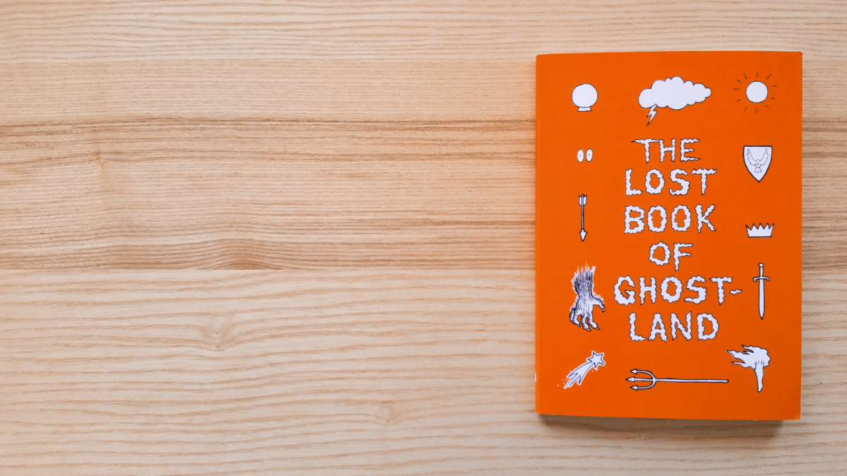 ghostland book on wood desk